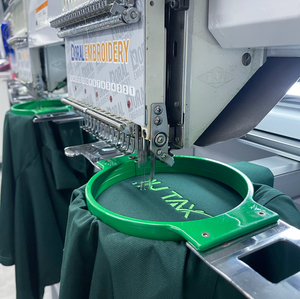 Industrial embroidery machine stitching a logo in our Miami workshop